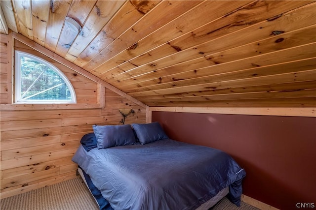 bedroom with carpet flooring, lofted ceiling, wooden walls, and wooden ceiling