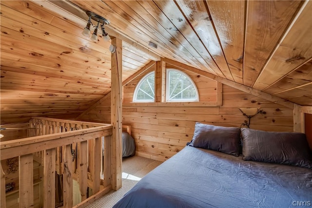 bedroom featuring wooden ceiling, vaulted ceiling, and wood walls