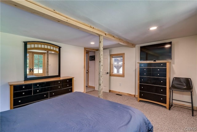 bedroom featuring light carpet