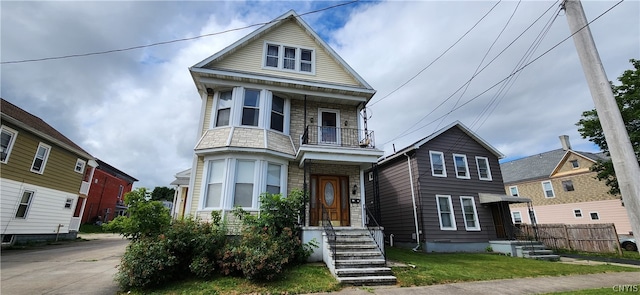 view of front of property with a balcony