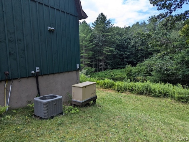 view of yard with central AC