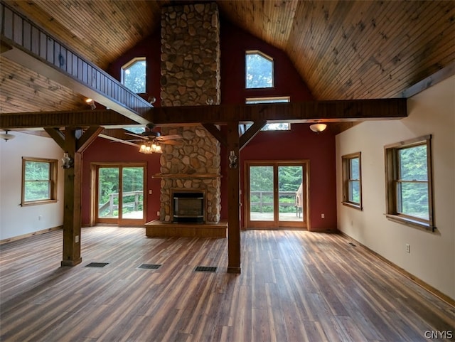 unfurnished living room featuring hardwood / wood-style flooring, a stone fireplace, high vaulted ceiling, and wooden ceiling