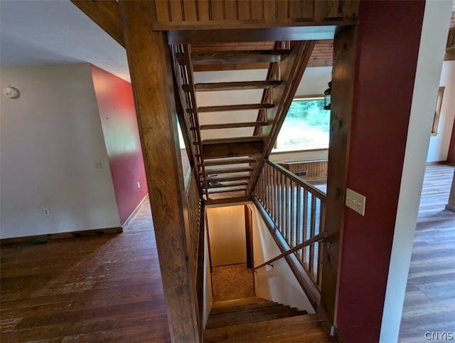 stairs featuring hardwood / wood-style flooring