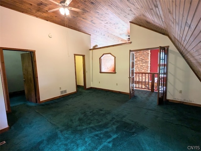 unfurnished bedroom with dark carpet and wood ceiling