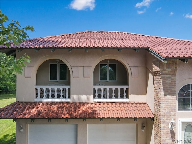 back of property with a garage