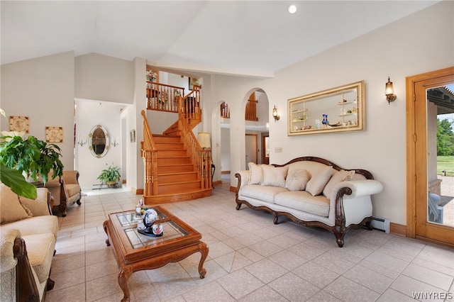 tiled living room featuring lofted ceiling and a baseboard radiator