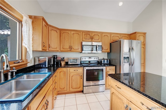 kitchen with stainless steel appliances, light tile patterned floors, tasteful backsplash, lofted ceiling, and sink