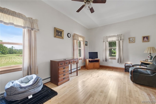 living room featuring vaulted ceiling, a baseboard heating unit, ceiling fan, and light hardwood / wood-style floors