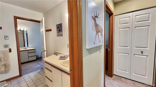 bathroom featuring tile patterned flooring and vanity