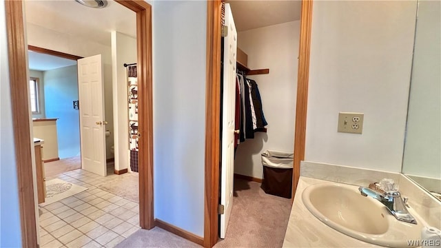 bathroom with tile patterned flooring and vanity