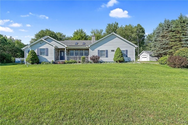 view of front of property with a chimney, covered porch, and a front yard
