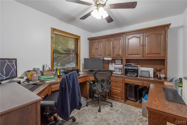 office area with light wood-type flooring and ceiling fan