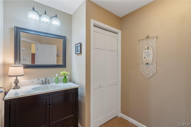 bathroom with tile patterned flooring and vanity