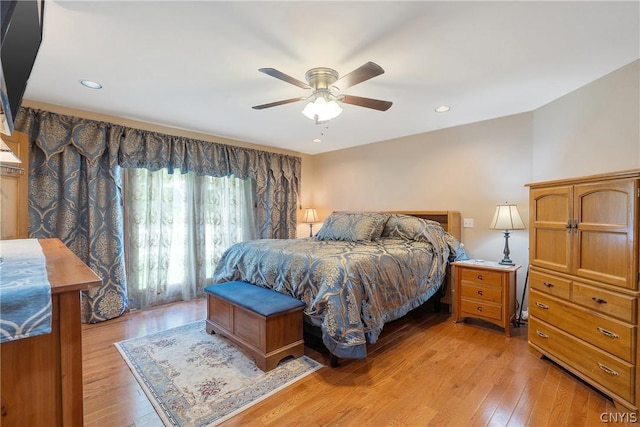 bedroom with a ceiling fan, recessed lighting, and light wood-style floors