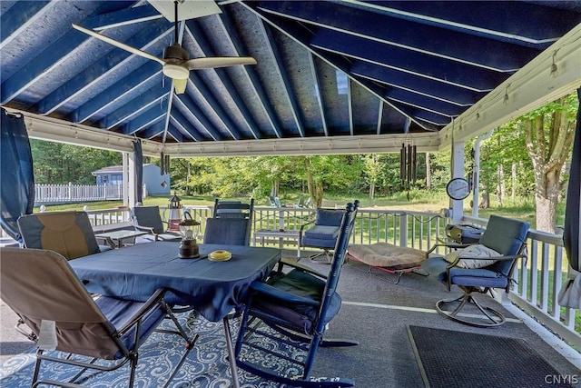 view of patio with a gazebo, outdoor dining space, and ceiling fan