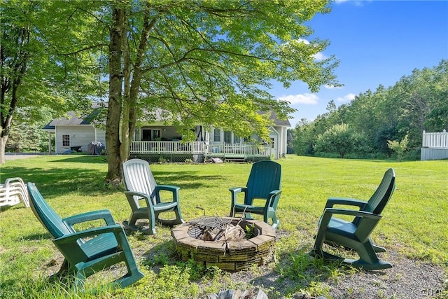 view of yard with an outdoor fire pit