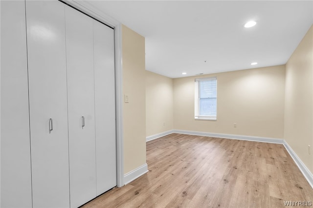 unfurnished bedroom with light wood-type flooring