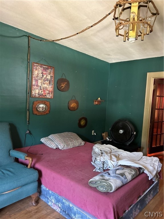 bedroom with wood-type flooring