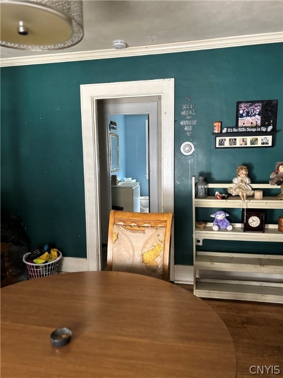 interior space with crown molding and wood-type flooring