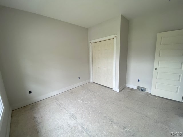 unfurnished bedroom with a closet