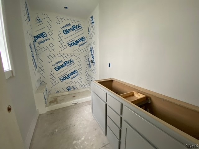 bathroom featuring concrete flooring