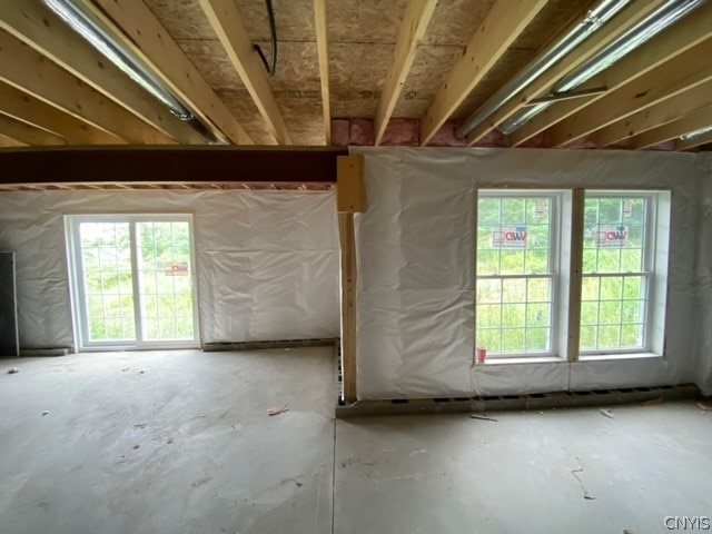 misc room with concrete floors and a wealth of natural light