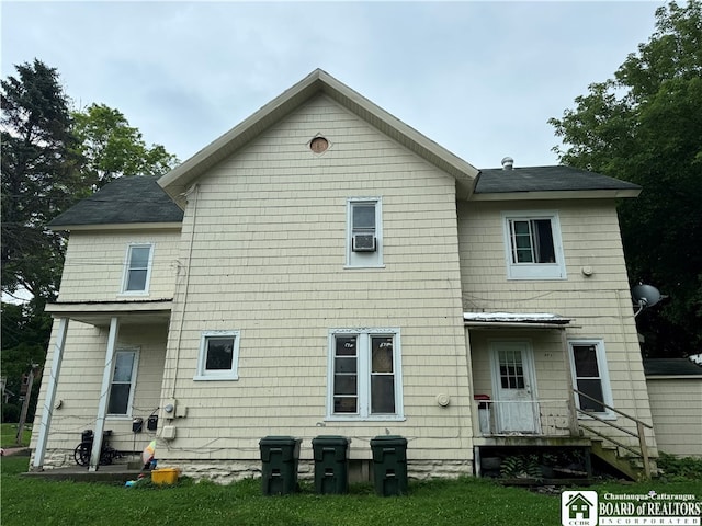 back of house with a yard