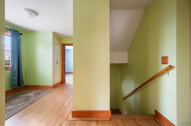 staircase with hardwood / wood-style flooring