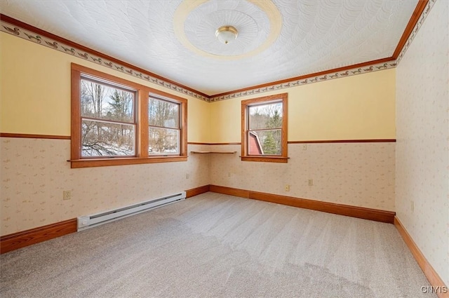 carpeted spare room with a textured ceiling and baseboard heating