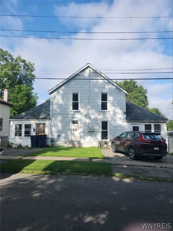 view of side of home with a lawn