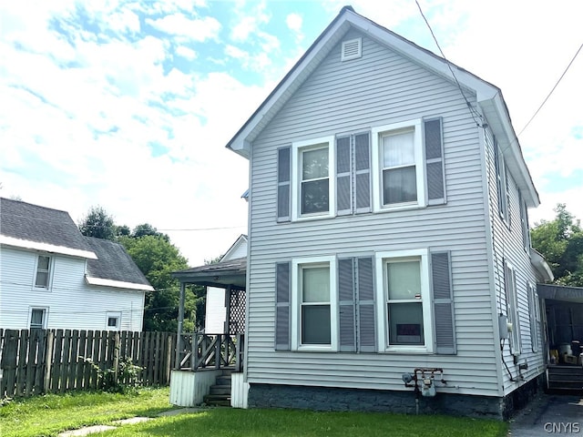 back of house with a yard