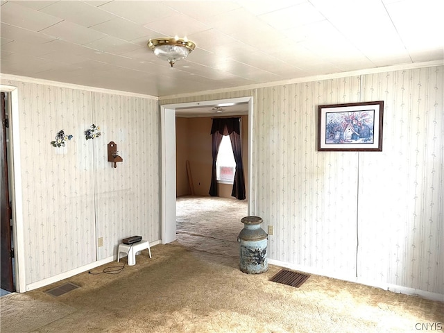 hallway featuring carpet and ornamental molding