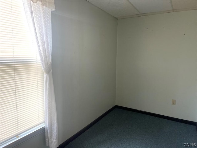 413 Fairview St, Watertown-City, NY 13601 - unfurnished room featuring dark carpet, a paneled ceiling, and baseboards