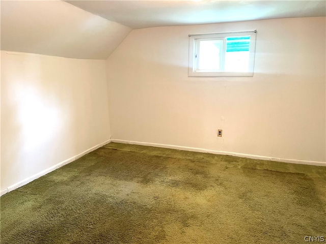 bonus room featuring carpet flooring and vaulted ceiling