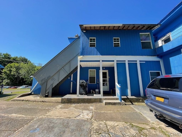 view of front of property with stairway