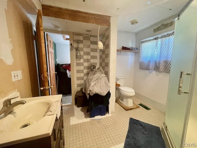 full bath with toilet, visible vents, vanity, tile patterned floors, and a stall shower