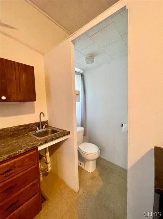 half bathroom with a sink and toilet