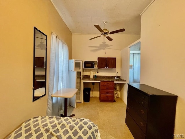 bedroom with ceiling fan, light floors, and a sink