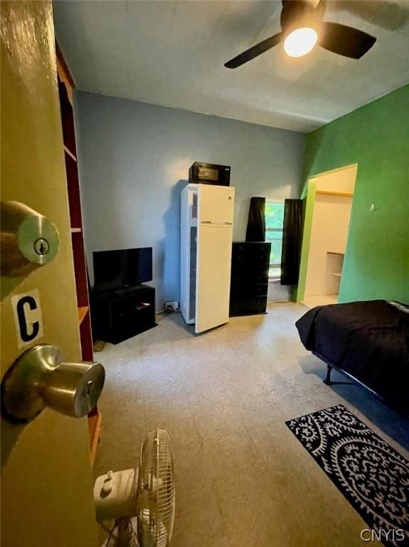 bedroom with a ceiling fan and light floors