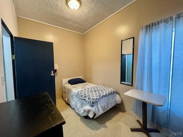 bedroom featuring crown molding