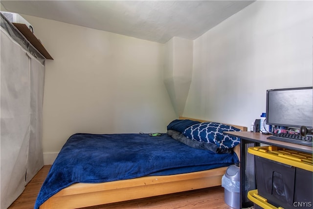 bedroom featuring hardwood / wood-style floors