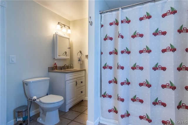 bathroom with tile patterned floors, vanity, and toilet