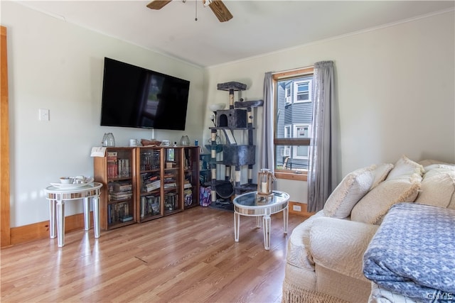 living room featuring ceiling fan and light wood-type flooring