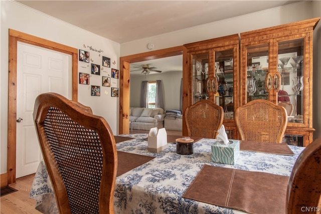 dining area featuring light hardwood / wood-style floors and ceiling fan