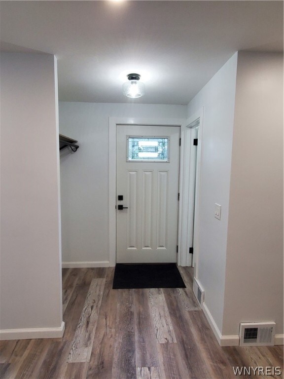 doorway to outside with hardwood / wood-style flooring