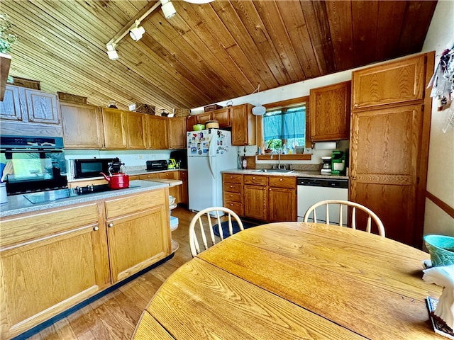 kitchen with light wood-type flooring, track lighting, black appliances, wooden ceiling, and sink