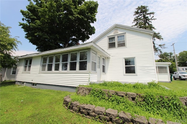 back of house with a yard