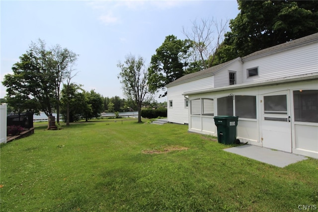 view of yard with a sunroom