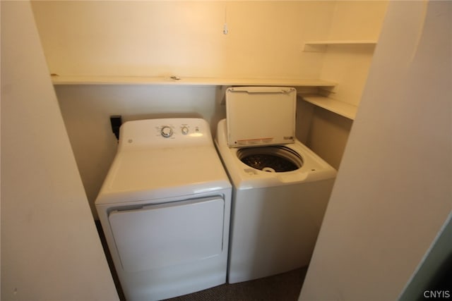 washroom with washing machine and clothes dryer