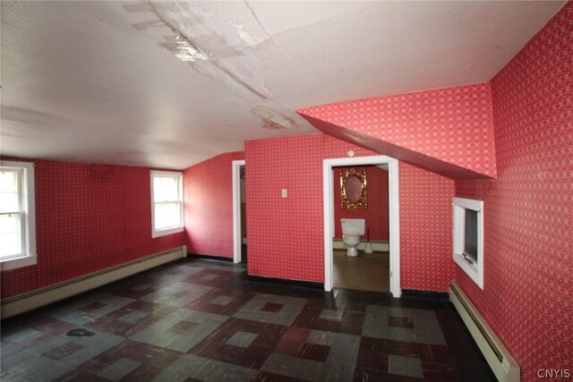 850 County Route 37, Hastings, NY 13036 - bonus room featuring a baseboard heating unit, tile patterned floors, lofted ceiling, wallpapered walls, and baseboards